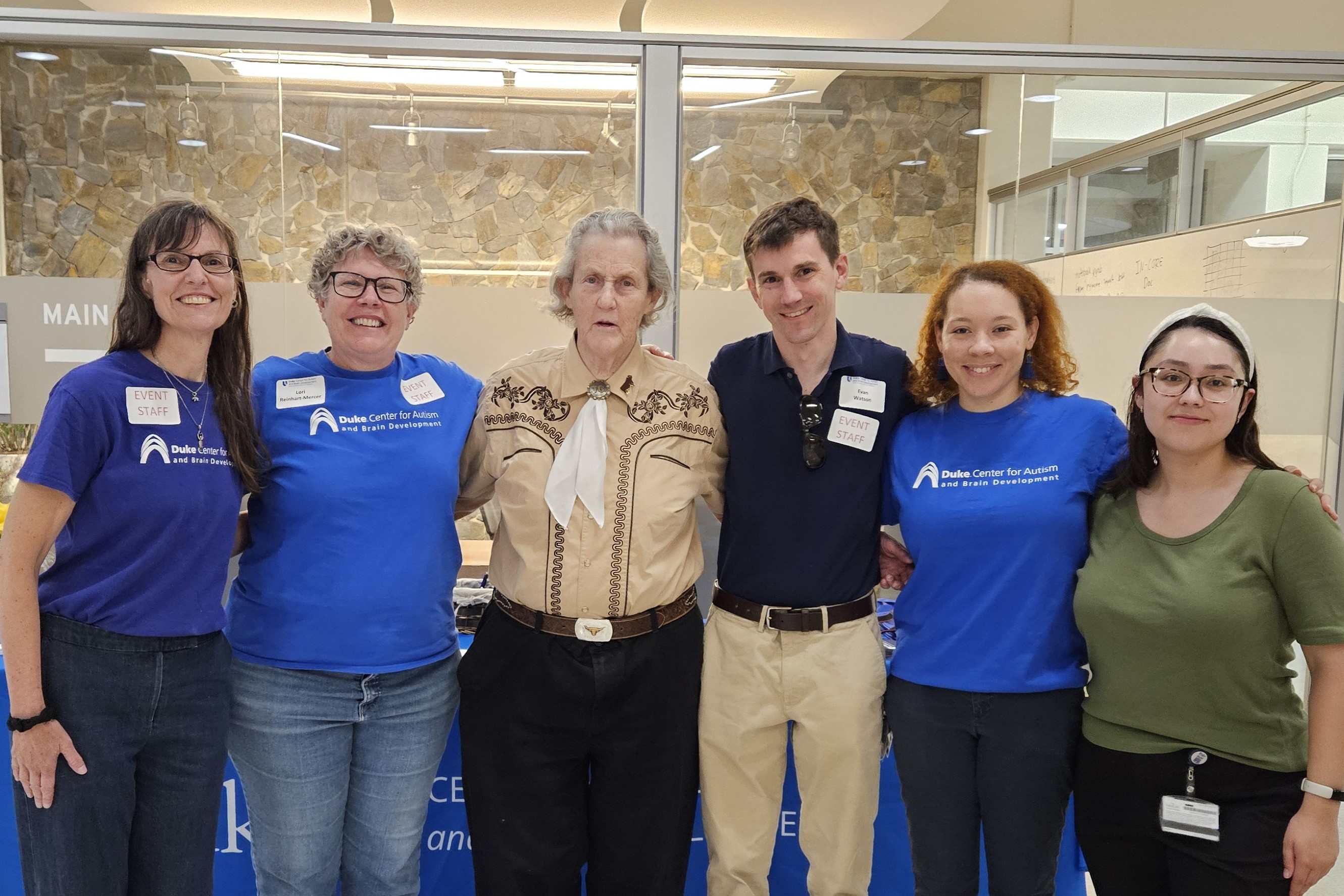 Autism Center staff with Temple Grandin