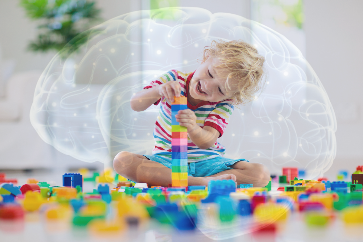 Child playing with blocks. Overlay of a brain with illuminated EEG points in the background.