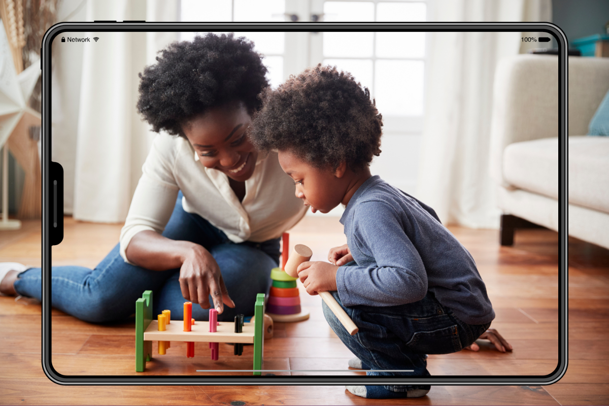 stock photo of woman and child playing with a toy
