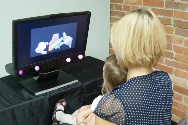 Mother and Child watch computer screen for study