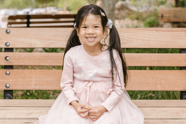 stock photo of girl on park bench