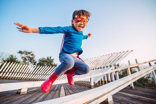 child in hero costume