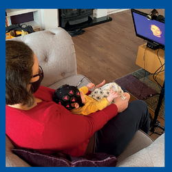 women with baby on lap getting EEG done