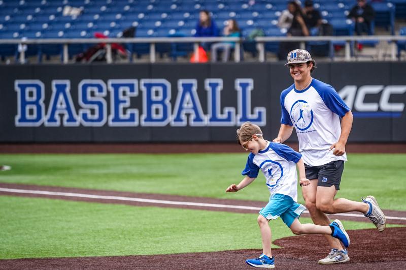 baseball player and child running