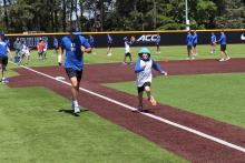 child running on baseball field