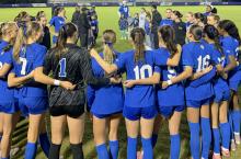 Duke womens soccer players in a circle