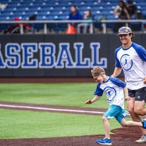 baseball player and child running