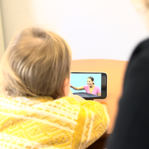 Child views video on ipad