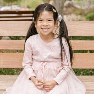 stock photo of girl on park bench