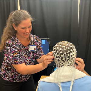 Alex Bey putting EEG on a participant